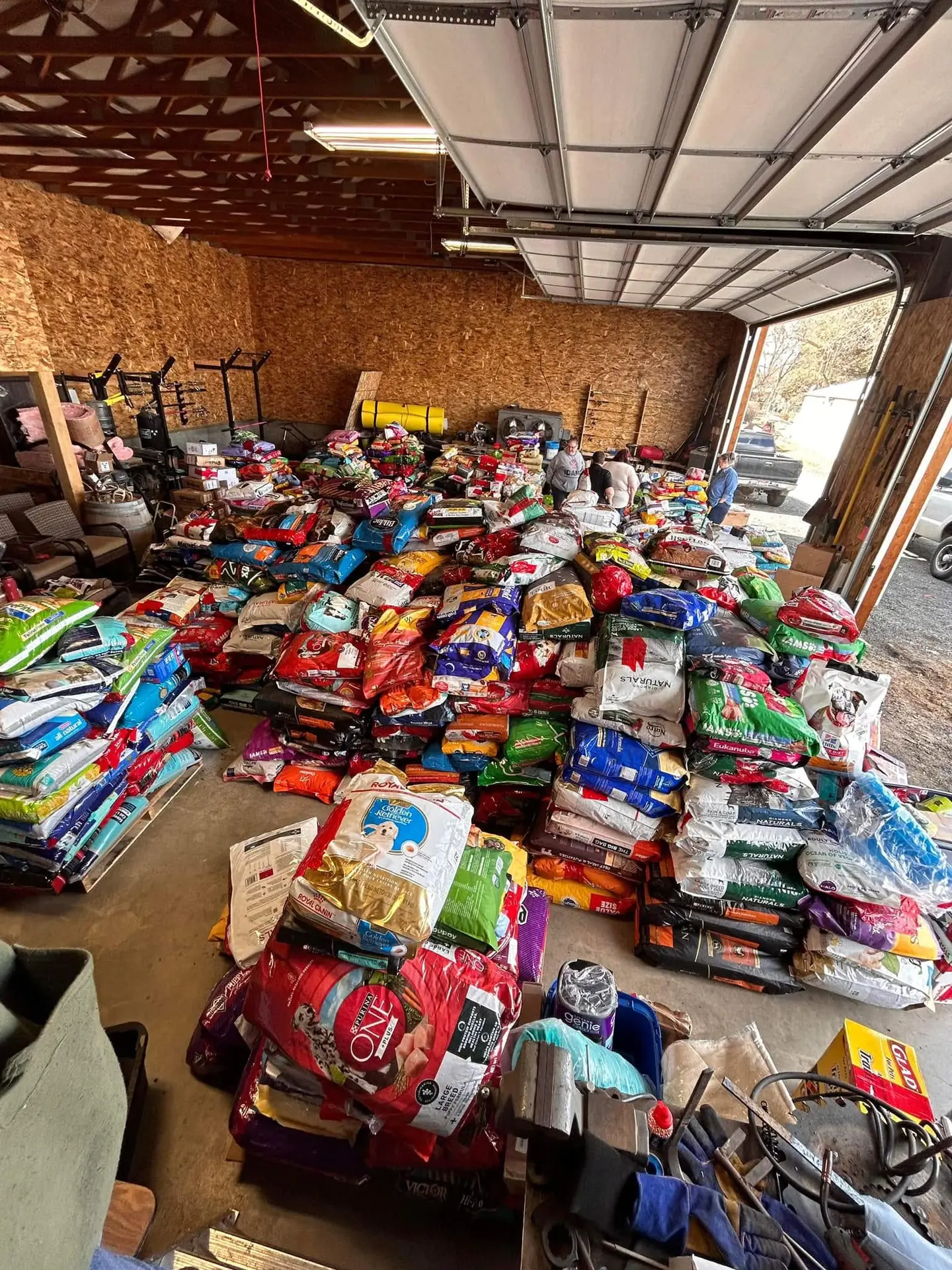 Stacks of donated pet food and supplies in the Pet Pantry warehouse